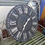 A distressed garden wall clock with Roman numeral dial