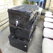 A set of three metal storage boxes and a