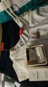 A pair of Vivienne Westwood pants and top, a Mary Quant poncho, a Biba bag and two Chanel boxes