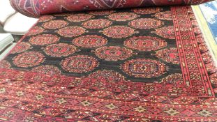 An extremely fine North East Persian Turkoman carpet 280cm x 179cm. Repeating Tekkeh goul motifs