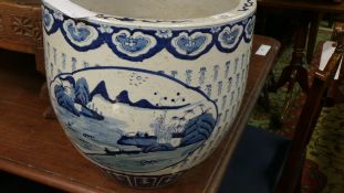 A Chinese style blue and white planter of bulbous form