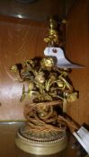 An ormolu table lamp with floral decorat