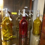 A collection of soda syphons