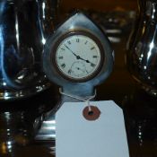 A silver Art Nouveau table watch and sta