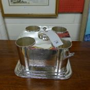 A silver plated four bottle wine cooler