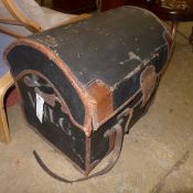 A domed leather and canvas steamer trunk