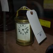 A late C19th French oval carriage clock