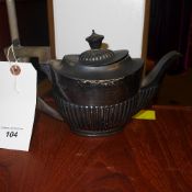 A Sheffield Silver teapot with wooden ha