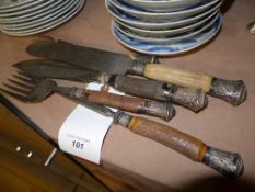 A C19th silver mounted horn carving set