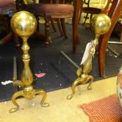 A pair of brass fire irons