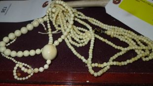 A collection of bone necklaces