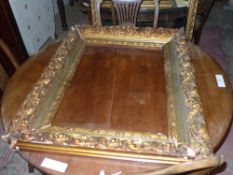 A heavy carved giltwood frame (AF)