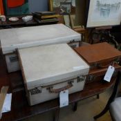 Two vellum vintage travelling cases and two vintage small briefcases