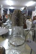 A silver plated embossed claret jug