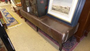 A brown leather banquette (a/f)