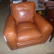 A pair of Ralph Lauren style tan leather armchairs on black feet W 105 D 102 H 90 cm