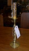A pair of brass spiral candlesticks on splayed base