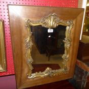 A pier mirror the shaped plate with carved gilt frame