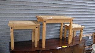 A pine nest of three tables