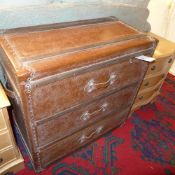 A faux leather luggage design three drawer chest
