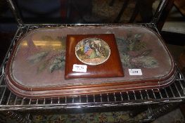 A Victorian mahogany beadwork stand on bun feet and a pot lid