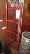 A wrought iron five tier plate stand