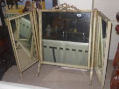 An Edwardian distressed and parcel gilt triple table top dressing mirror