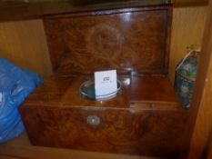 A Regency burr elm tea caddy with hinged lid containing lidded compartments and mixing bowl with