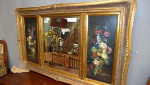 A gilted overmantel mirror flanked by floral panels
