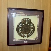 A bronzed Chinese style plaque within ebonised frame