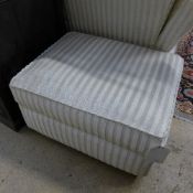 A multi york beige small Ottoman on black feet
