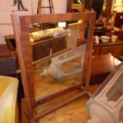 A Victorian mahogany swing frame toilet mirror
