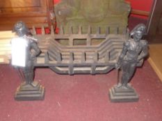 A cast iron fire basket with fire dogs in the form of Lord Nelson