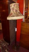 An oak barley twist standered lamp with shade