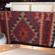 A hand made Persian Kelim decorated with geometric motifs 185 x 102 cm