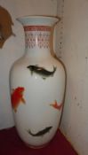 A pair of Chinese vases glazed white and decorated with carp