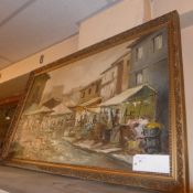An oil on canvas market scene in a gilt frame