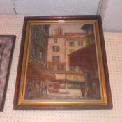 An oil on canvas French street scene signed bottom right