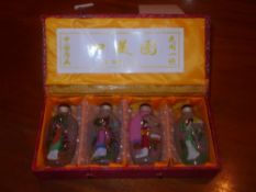 A set of four Chinese snuff bottles decorated with ladies