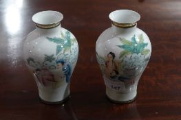 A pair of Chinese vases of small size with erotic pictorial reserves