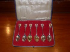 A set of six hallmarked silver and enamelled tea spoons in case