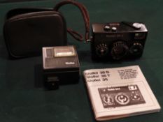 A Rollei 35S camera in original case and the matching flash
