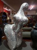 A mirrored mosaic style model of female form