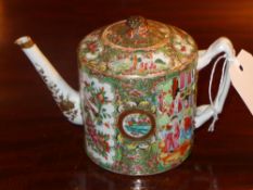 A C19th Chinese porcelain famille rose teapot decorated with many pictorial reserves