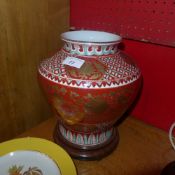 A Chinese vase with red glaze and heightened in gilt