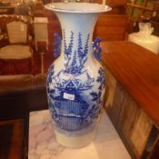 A pair of antique Chinese blue and white vases with floral decoration