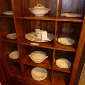 A Burleighware dinner service decorated with green bows on a cream ground