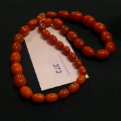 A 1920's bakelite amber coloured beaded necklace
