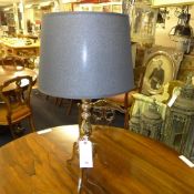 A pair of chromium table lamps with shades