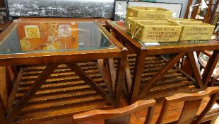 A pair of contemporary glass top side/low tables
